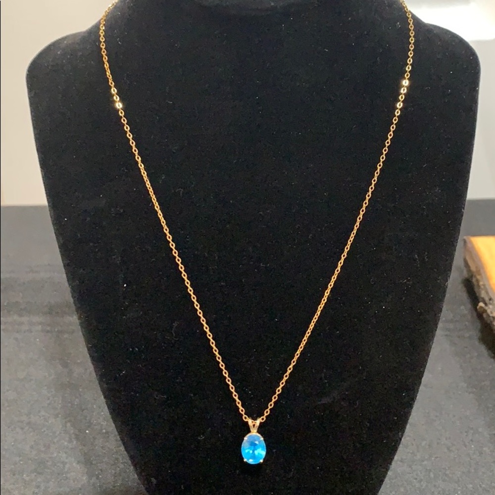 Gold plated necklace with a blue stone pendant
